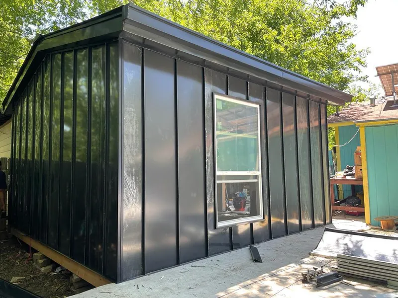 Black standing seam metal wall panels for Roof Inspection in Springville