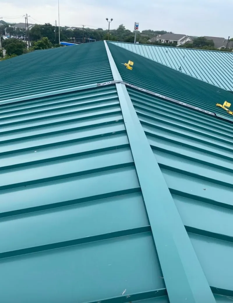 Green commercial metal roof ridge and valley for Metal Roof Repair in Springville